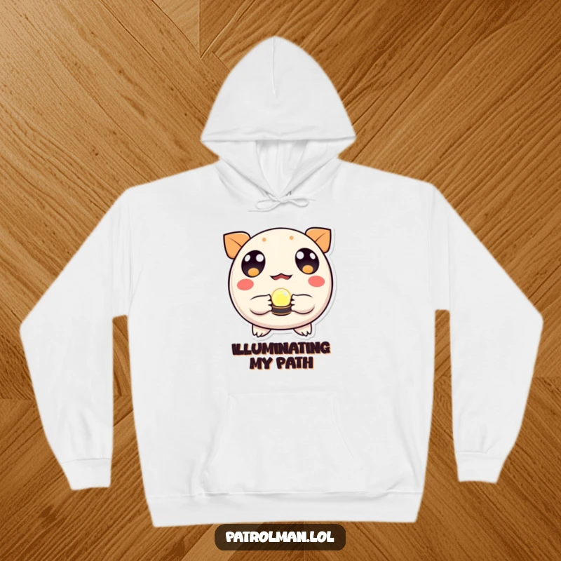 Funny hoodie with a round, wide-eyed creature holding a glowing beacon, radiating warmth and direction.